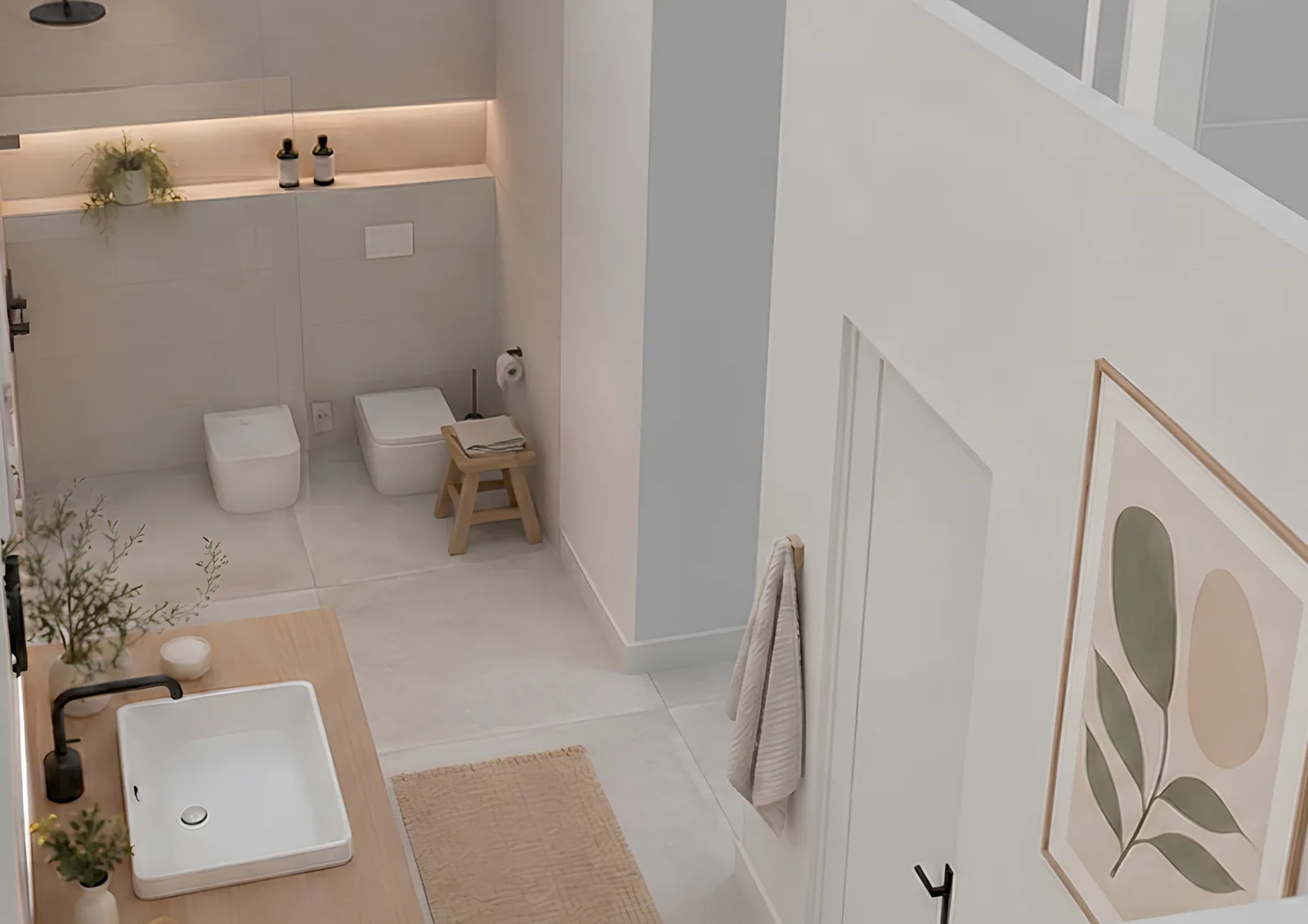 Bagno con gres di grande formato, sanitari filo parete e rubinetteria nera.